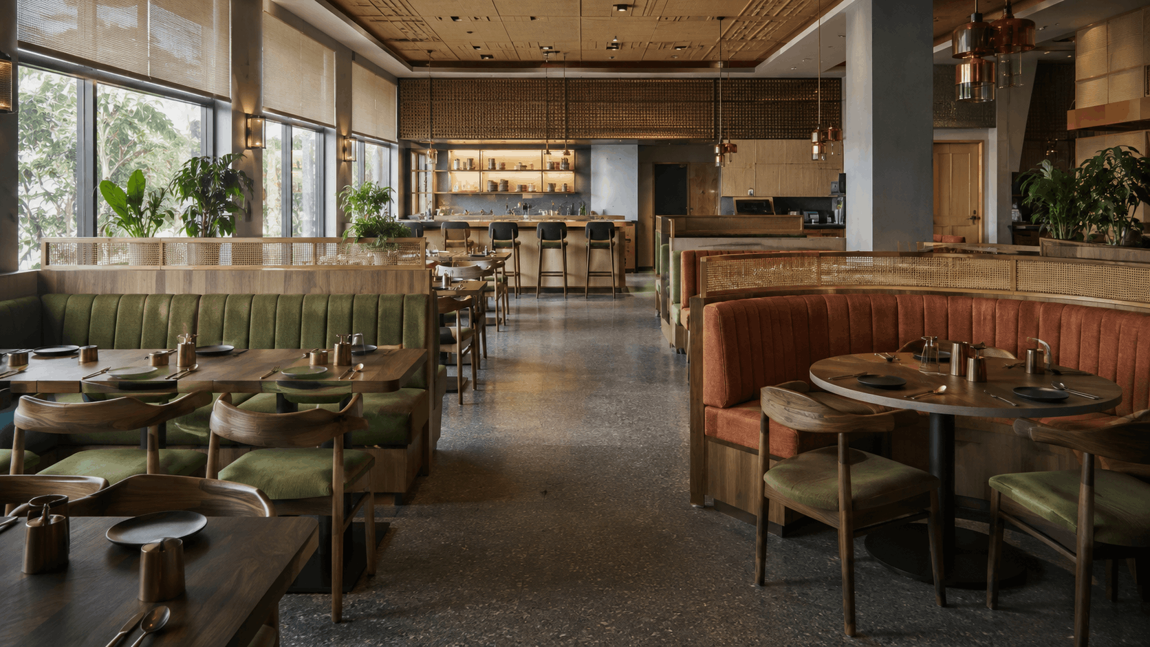 Restaurant with green and terracotta channel-tufted booth seating, wood dining chairs, and a bar counter with stools